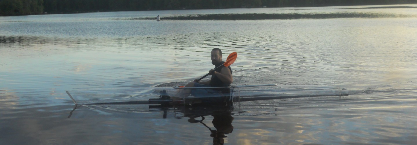 Mark Hebel paddling a clear kayak in St. Lawrence county ny