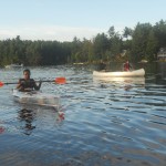 Jemilla paddling clear kayak front view
