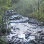 Bronco Jeep in deep mud to headlights at twisted trails