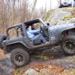 Jeep JK tire smoke climbing rock