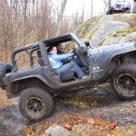 Jeep JK tire smoke climbing rock